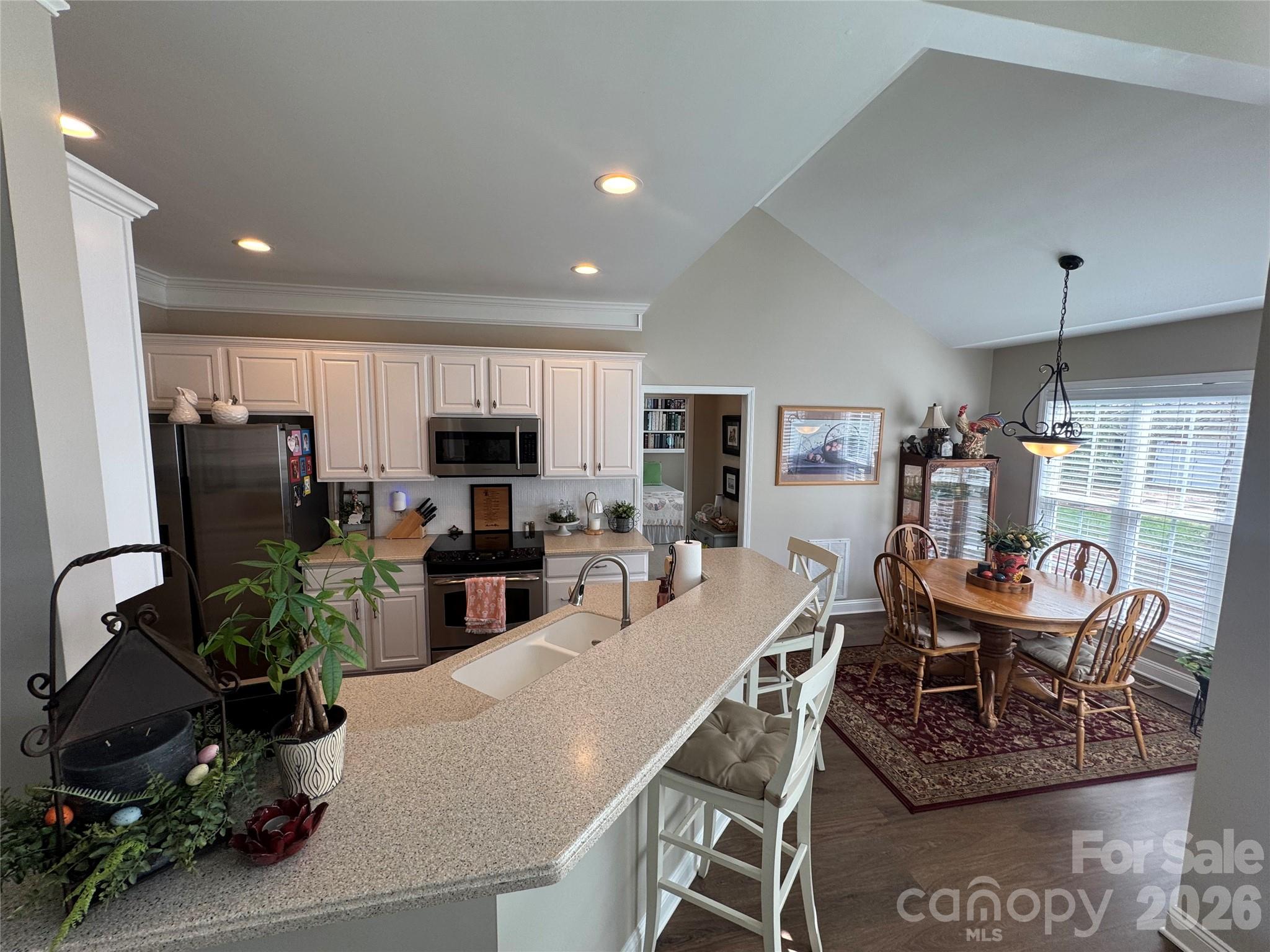110 Burtons Barn Road Mooresville, NC 28115 - Photo 20 of 37 a view of a dining room with furniture window and wooden floor
