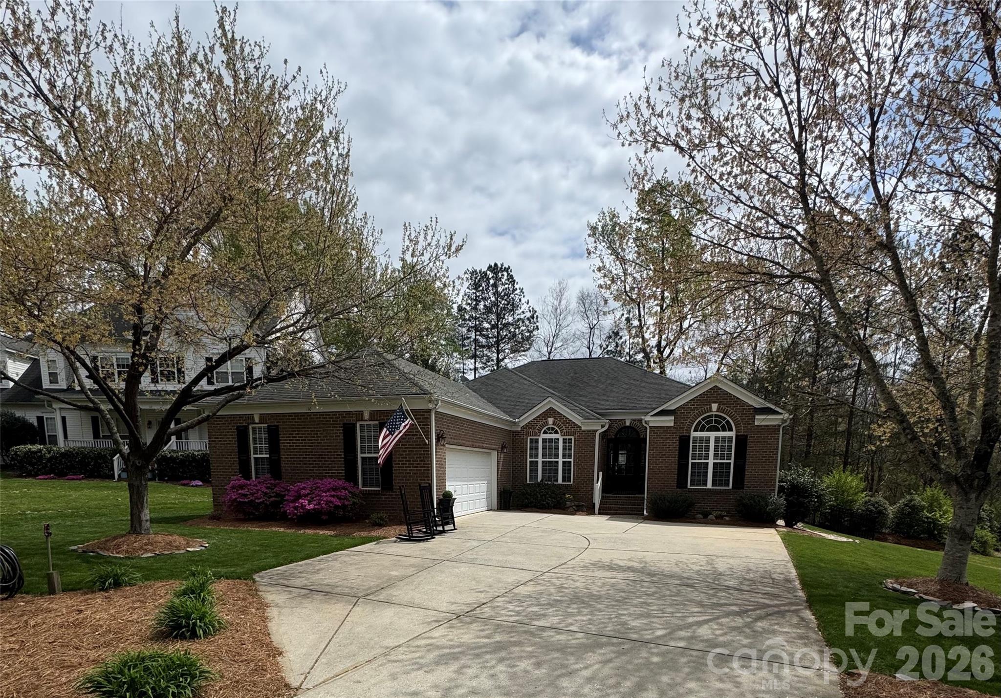 110 Burtons Barn Road Mooresville, NC 28115 - Photo 2 of 37 a front view of a house with a yard and garage