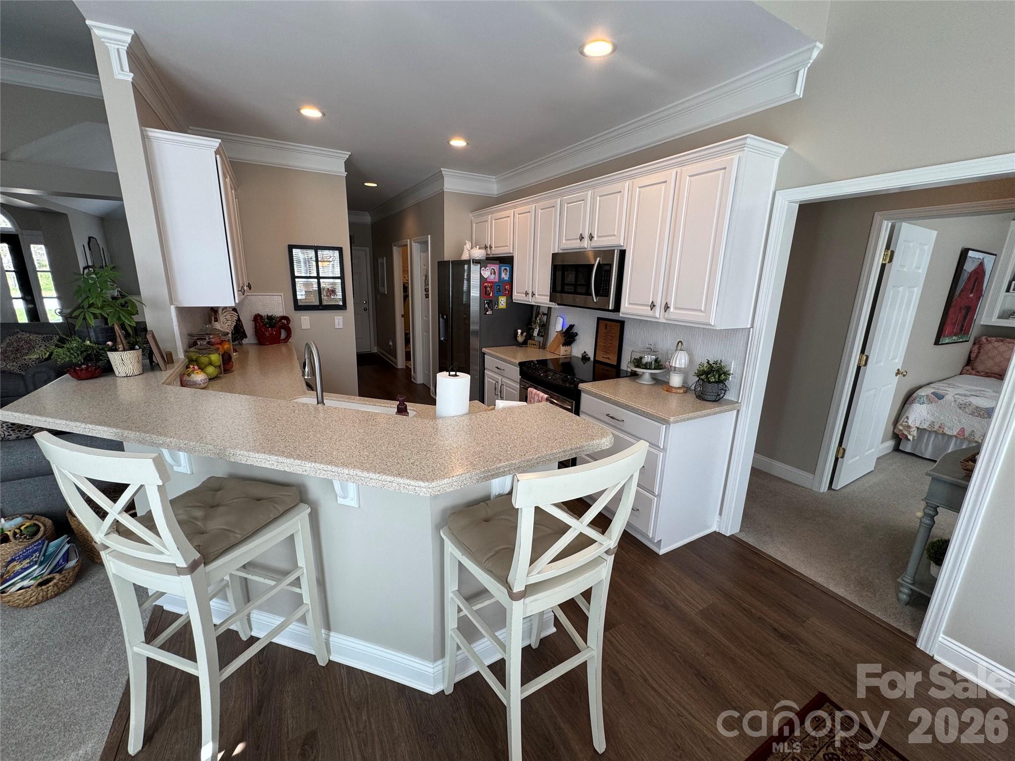 110 Burtons Barn Road Mooresville, NC 28115 - Photo 21 of 37 a view of a dining room with furniture and a flat screen tv