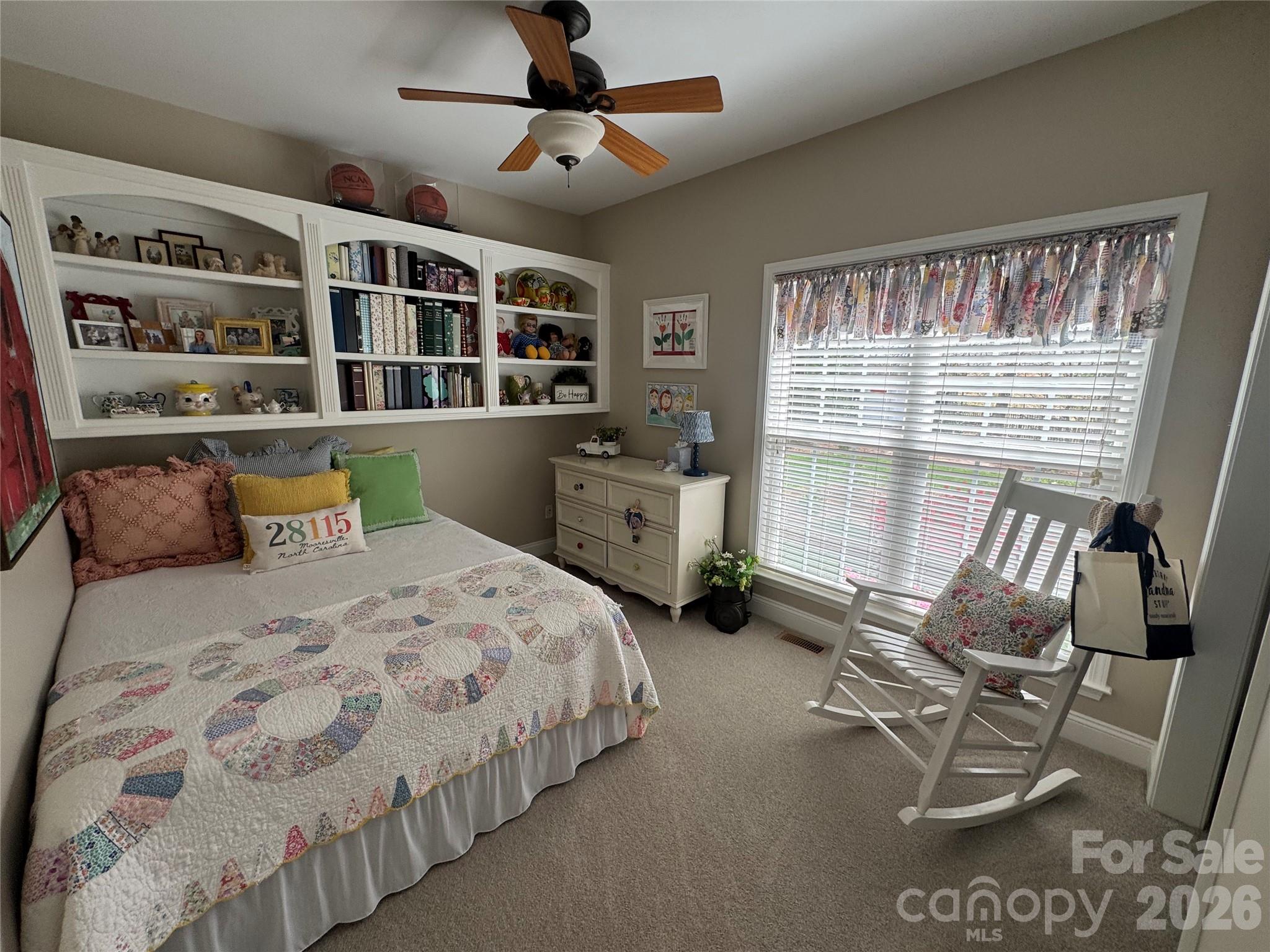 110 Burtons Barn Road Mooresville, NC 28115 - Photo 23 of 37 a bedroom with furniture and large windows