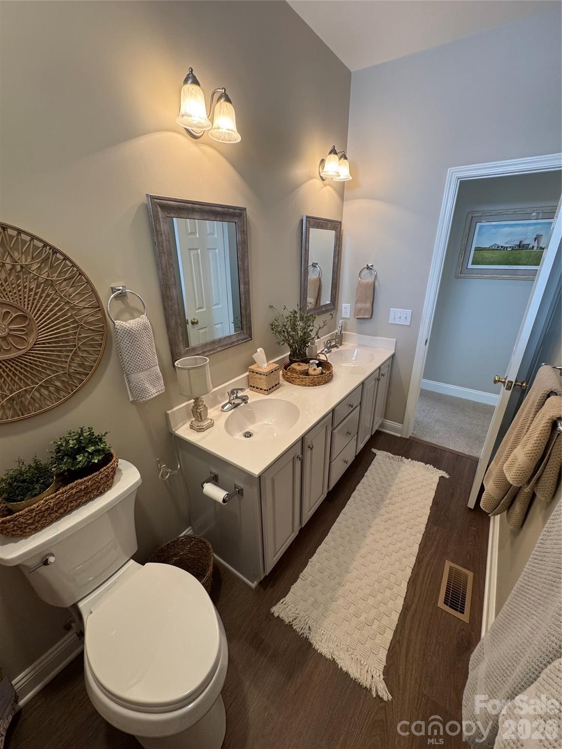 110 Burtons Barn Road Mooresville, NC 28115 - Photo 24 of 37 a bathroom with a toilet a sink and mirror