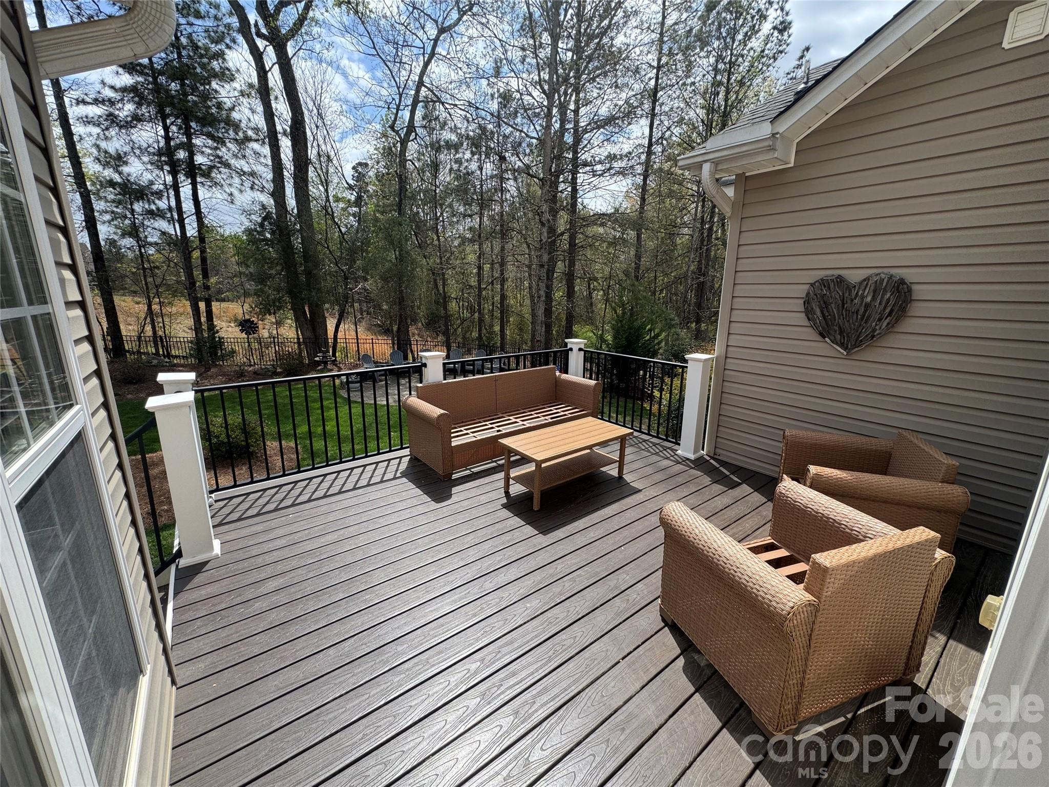 110 Burtons Barn Road Mooresville, NC 28115 - Photo 28 of 37 a backyard of a house with wooden floor and outdoor seating