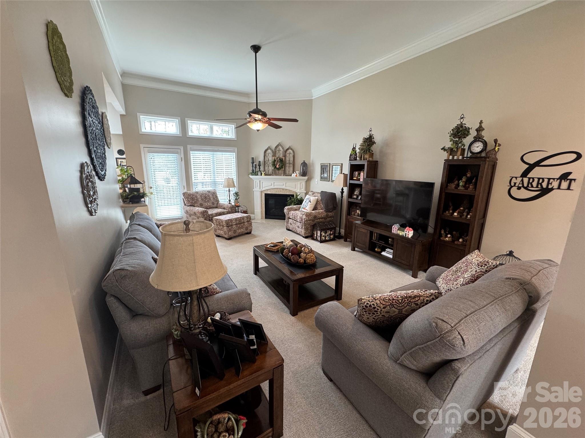110 Burtons Barn Road Mooresville, NC 28115 - Photo 5 of 37 a living room with furniture and a chandelier