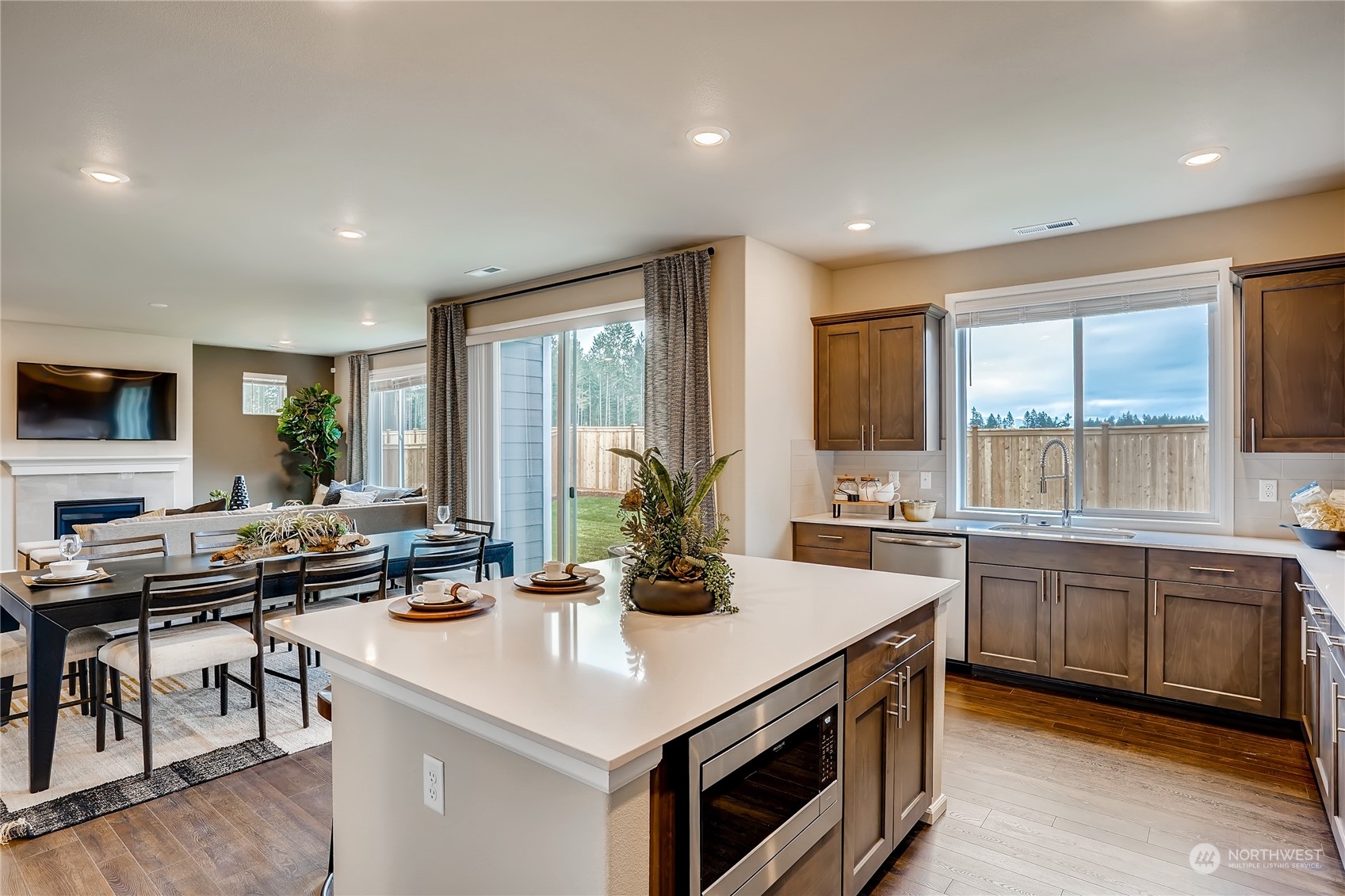 4131 235th Place Southeast, Unit 40 Bothell, WA 98021 - Photo 14 of 24 a kitchen with sink stove and chairs