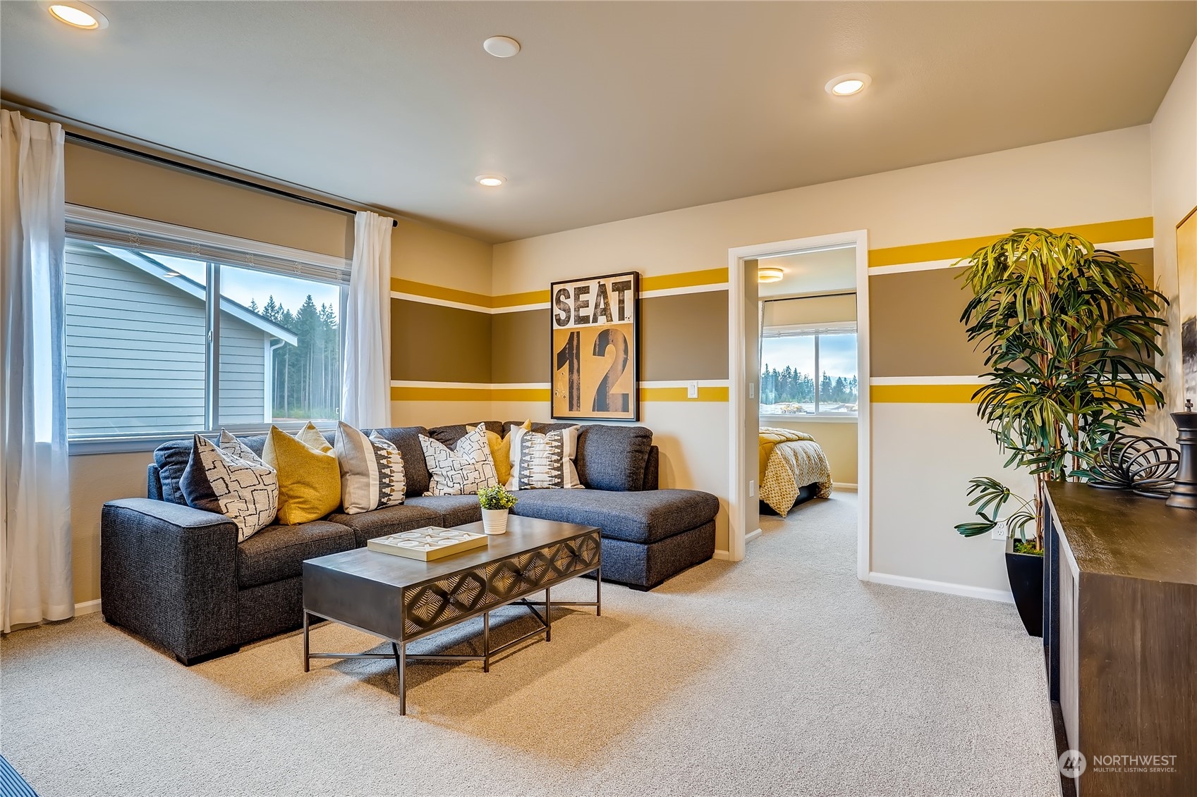 4131 235th Place Southeast, Unit 40 Bothell, WA 98021 - Photo 18 of 24 a living room with furniture and a potted plant