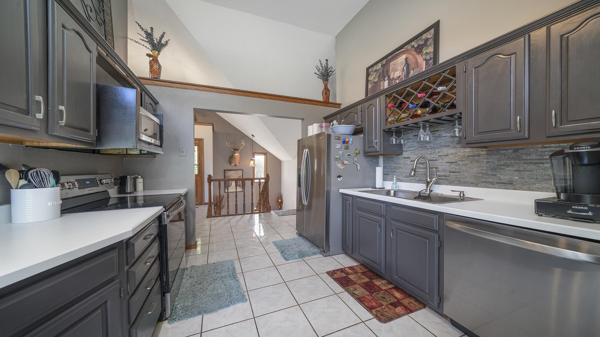 4432 Highway 2 Oregon, IL 61061 - Photo 17 of 49 a kitchen with stainless steel appliances granite countertop a sink stove and cabinets