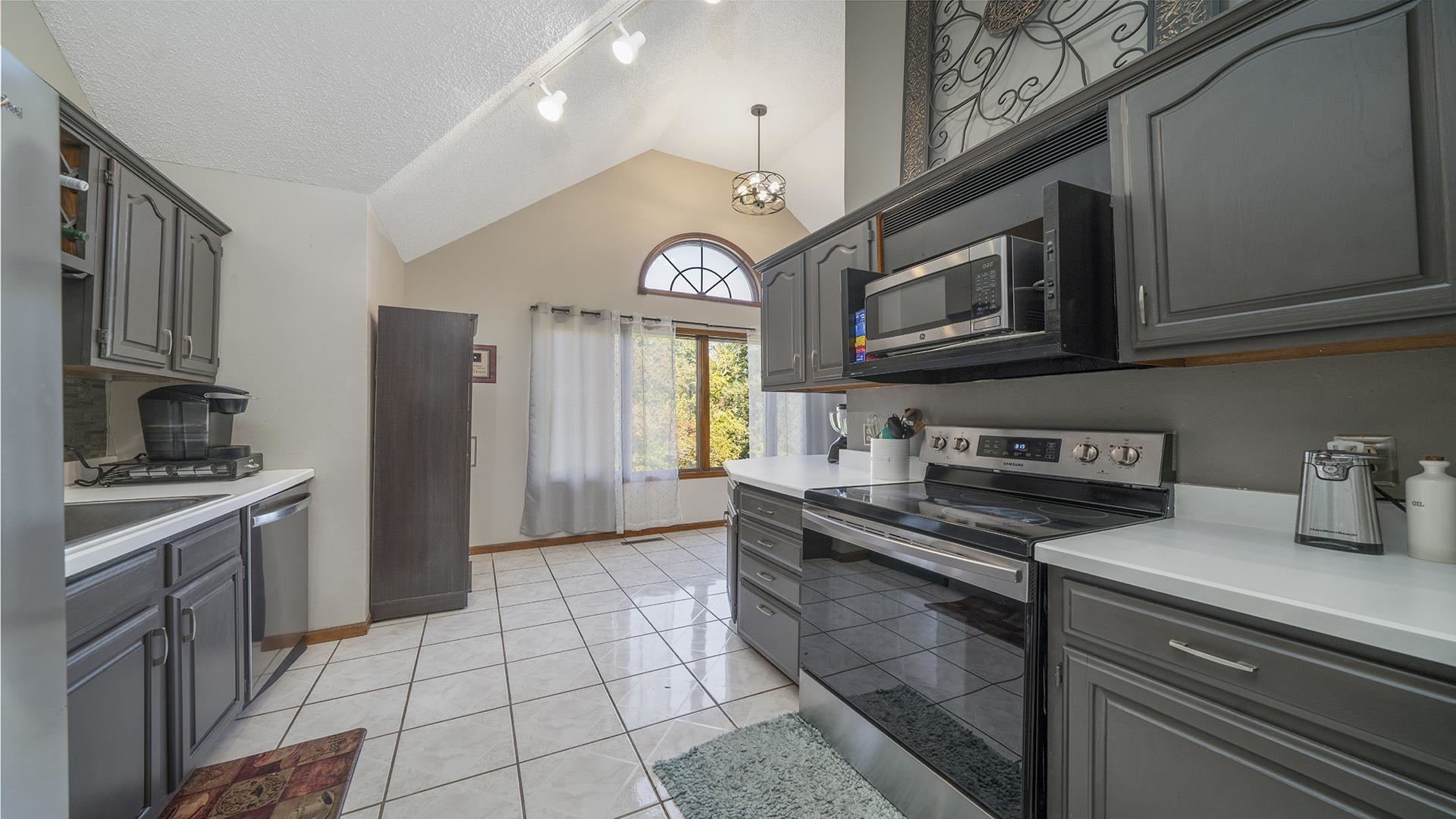 4432 Highway 2 Oregon, IL 61061 - Photo 18 of 49 a kitchen with stainless steel appliances granite countertop a stove a sink and a refrigerator