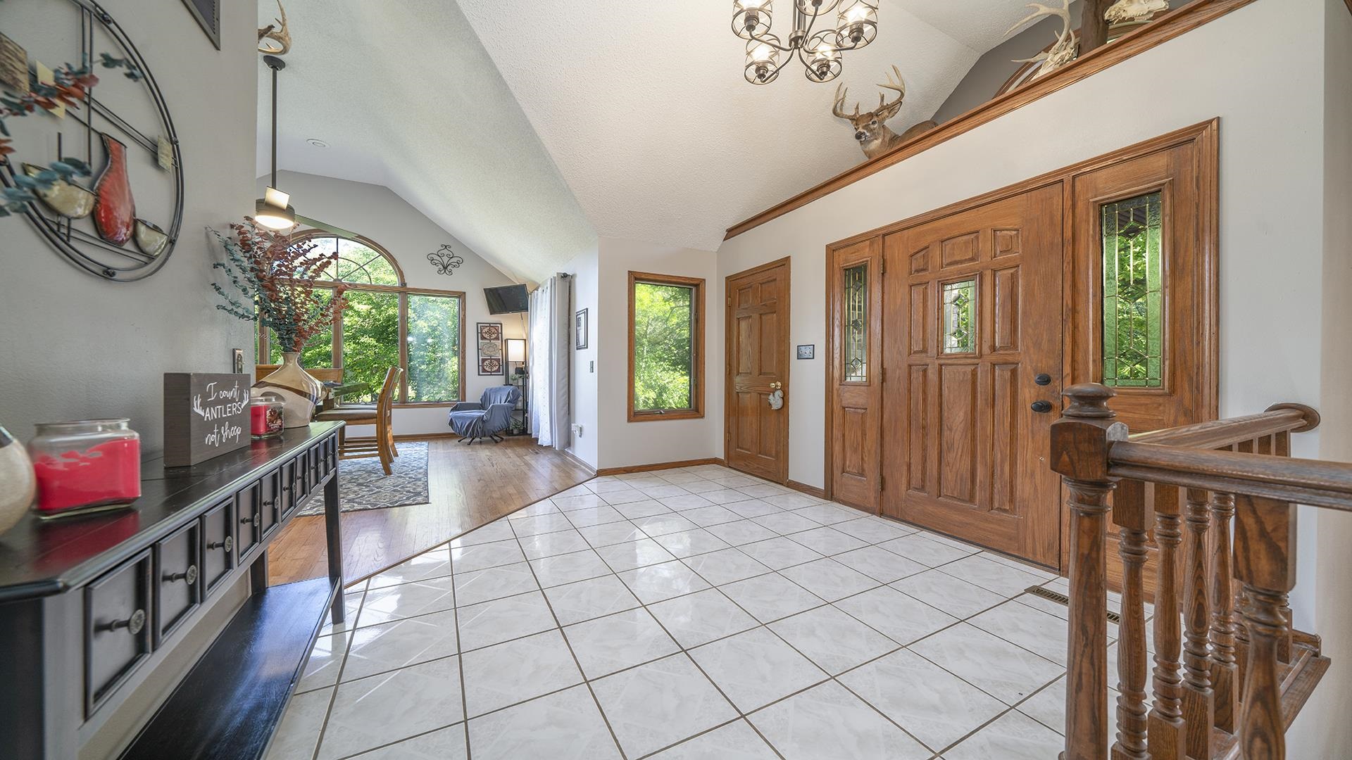4432 Highway 2 Oregon, IL 61061 - Photo 23 of 49 a view of an entryway with a flower pot and a bookshelf