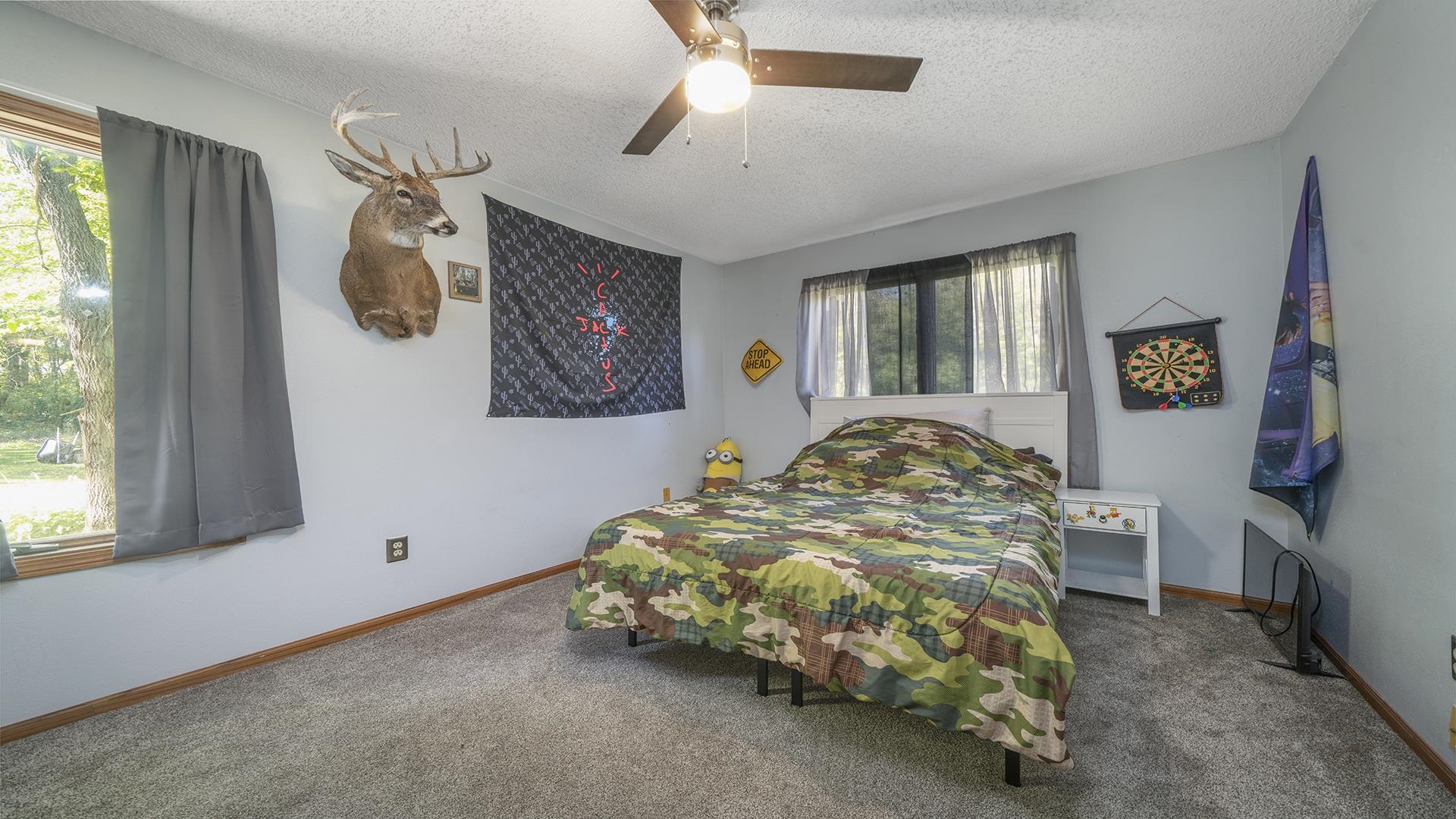 4432 Highway 2 Oregon, IL 61061 - Photo 28 of 49 a bed sitting in a bedroom next to a window