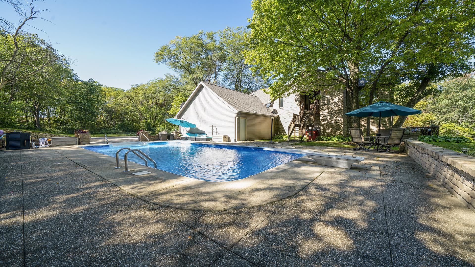 4432 Highway 2 Oregon, IL 61061 - Photo 8 of 49 a view of a swimming pool with a patio