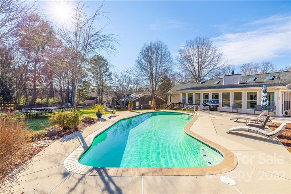 5100 Rounding Run Road Charlotte, NC 28277 - Photo 1 of 46 a view of a swimming pool with a lounge chairs
