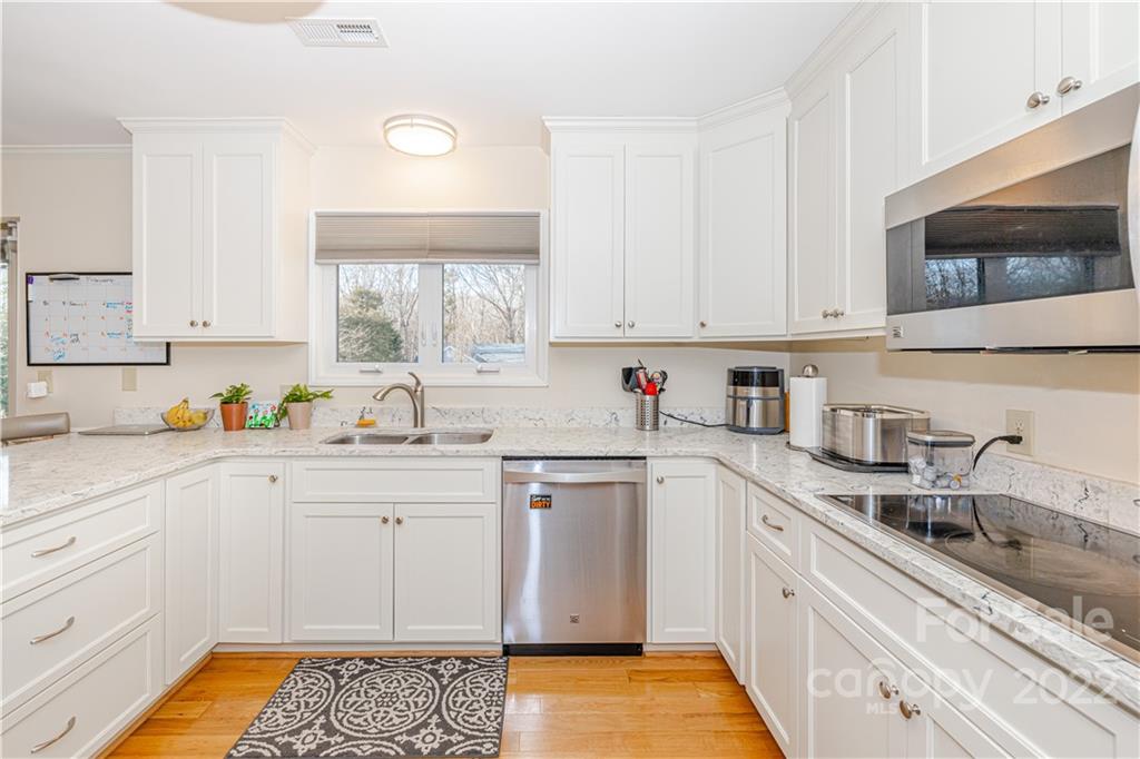 5100 Rounding Run Road Charlotte, NC 28277 - Photo 12 of 46 a kitchen with granite countertop a sink stainless steel appliances and cabinets