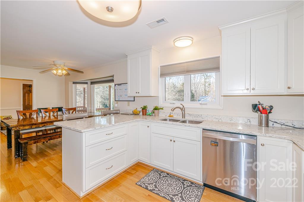 5100 Rounding Run Road Charlotte, NC 28277 - Photo 13 of 46 a kitchen with white cabinets and sink