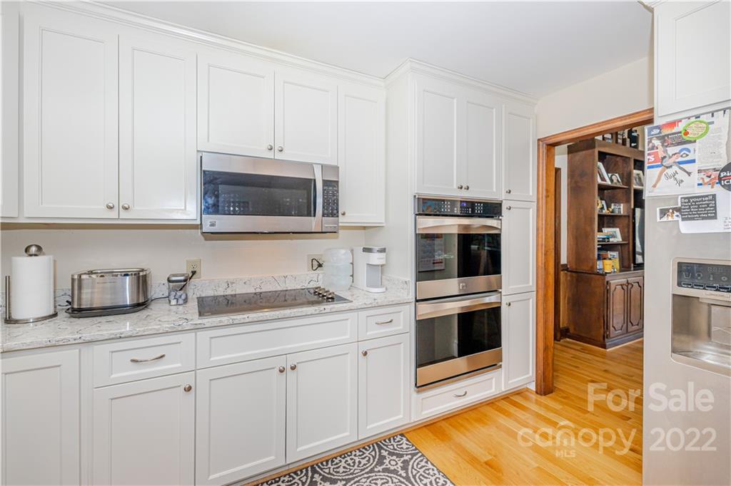 5100 Rounding Run Road Charlotte, NC 28277 - Photo 16 of 46 a kitchen with stainless steel appliances granite countertop a refrigerator and a stove top oven