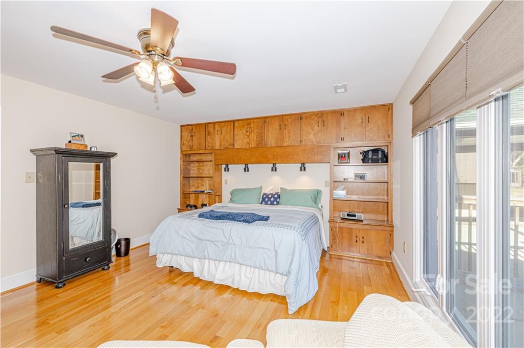 5100 Rounding Run Road Charlotte, NC 28277 - Photo 19 of 46 a bedroom with a bed and wooden floor