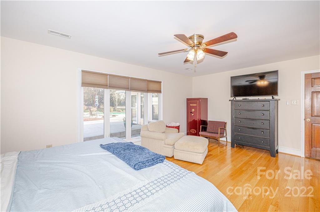 5100 Rounding Run Road Charlotte, NC 28277 - Photo 21 of 46 a bedroom with a bed dresser and a flat screen tv