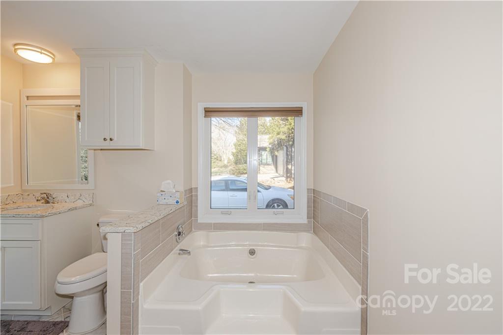 5100 Rounding Run Road Charlotte, NC 28277 - Photo 26 of 46 a large white tub sitting in a bathroom