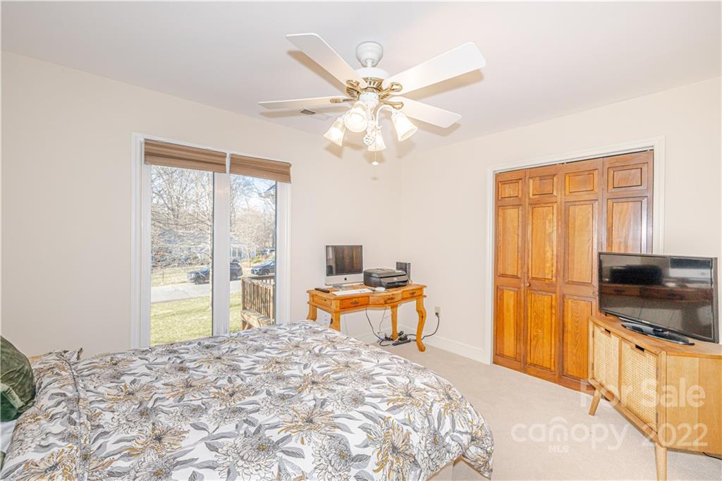5100 Rounding Run Road Charlotte, NC 28277 - Photo 27 of 46 a bedroom with a bed and a large window with the outer view