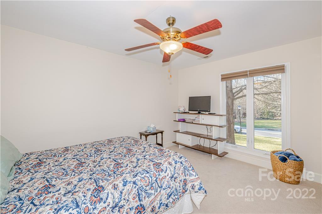 5100 Rounding Run Road Charlotte, NC 28277 - Photo 29 of 46 a bedroom with a bed and a chandelier