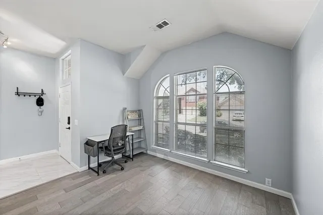 a view of a livingroom with furniture and a window
