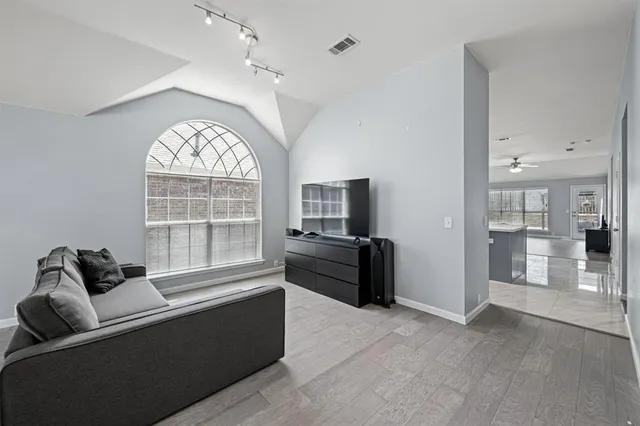 a living room with furniture and a large window