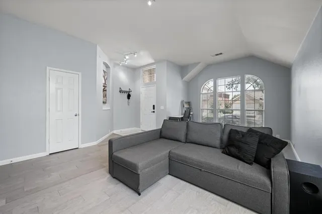 a living room with furniture and a large window