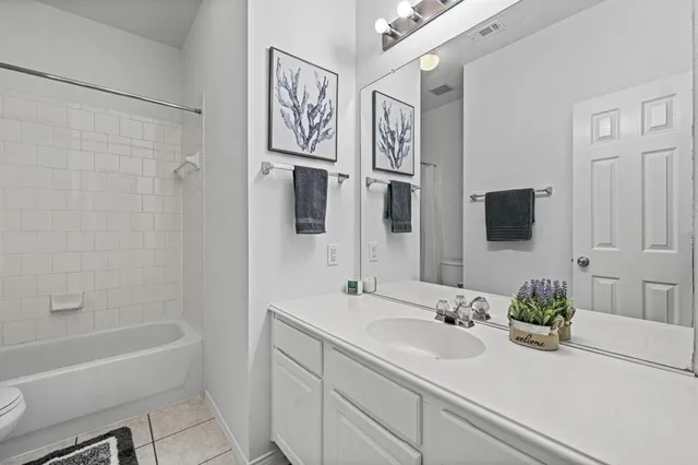 a bathroom with a bathtub and toilet