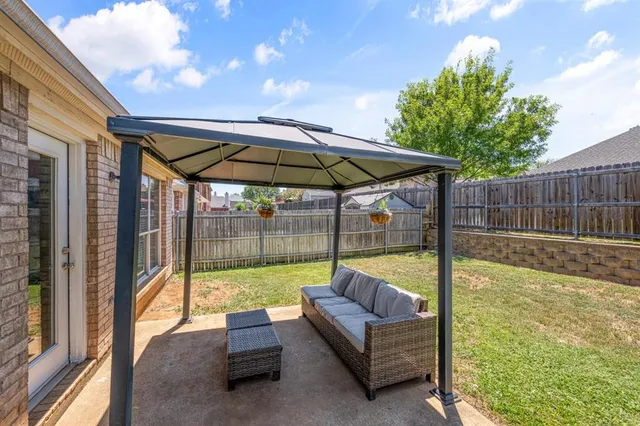 a view of a house with swimming pool and sitting area