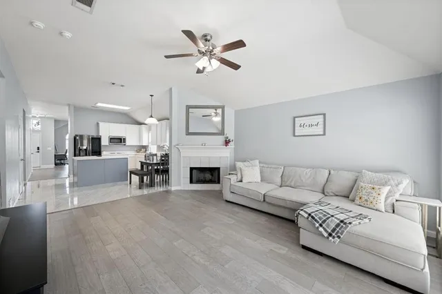 a living room with furniture and a fireplace