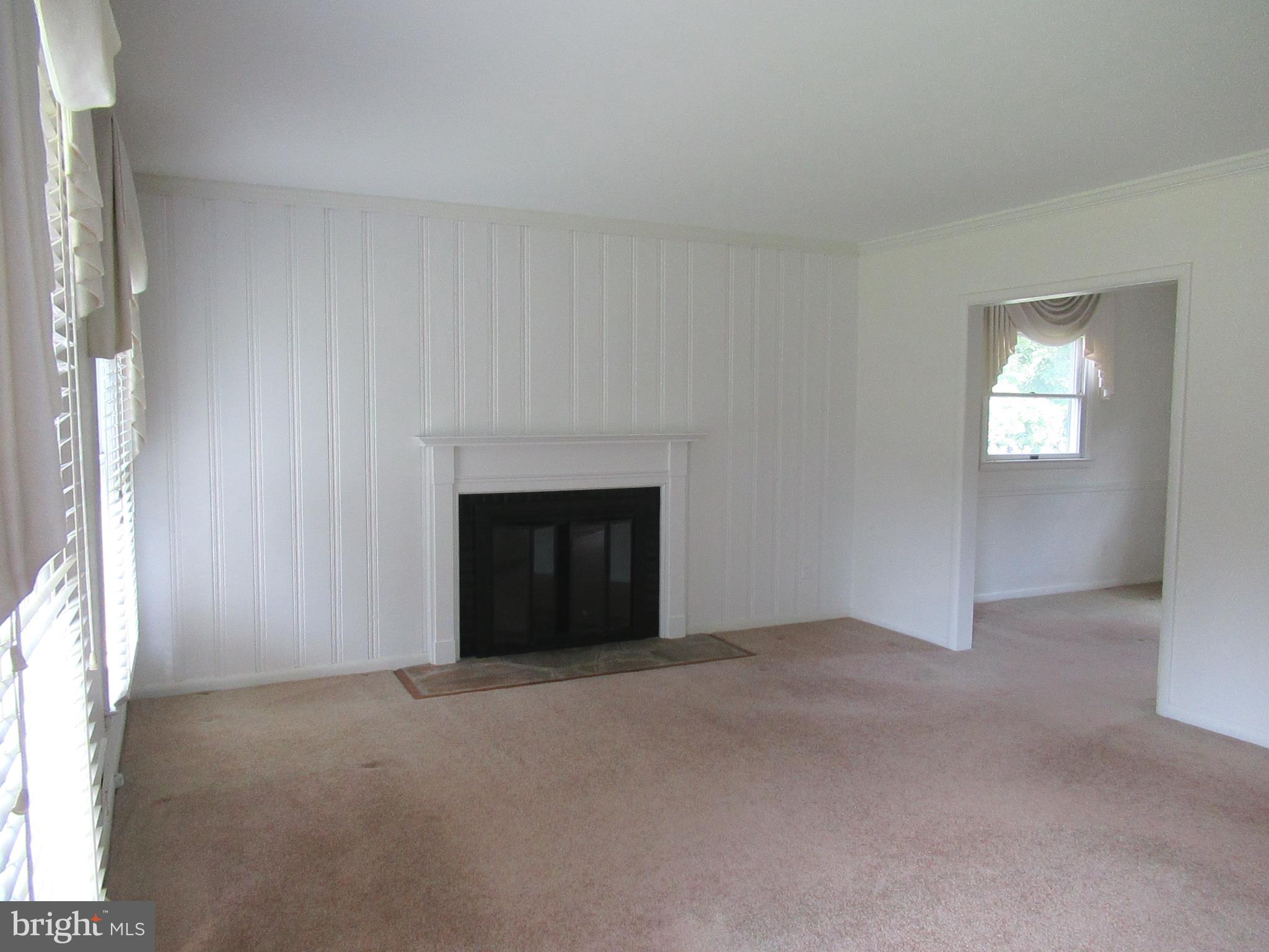 577 Brook Road Baltimore, MD 21286 - Photo 2 of 30 Living room with wood burning fireplace