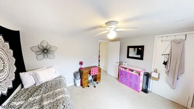a bedroom with furniture and a chandelier