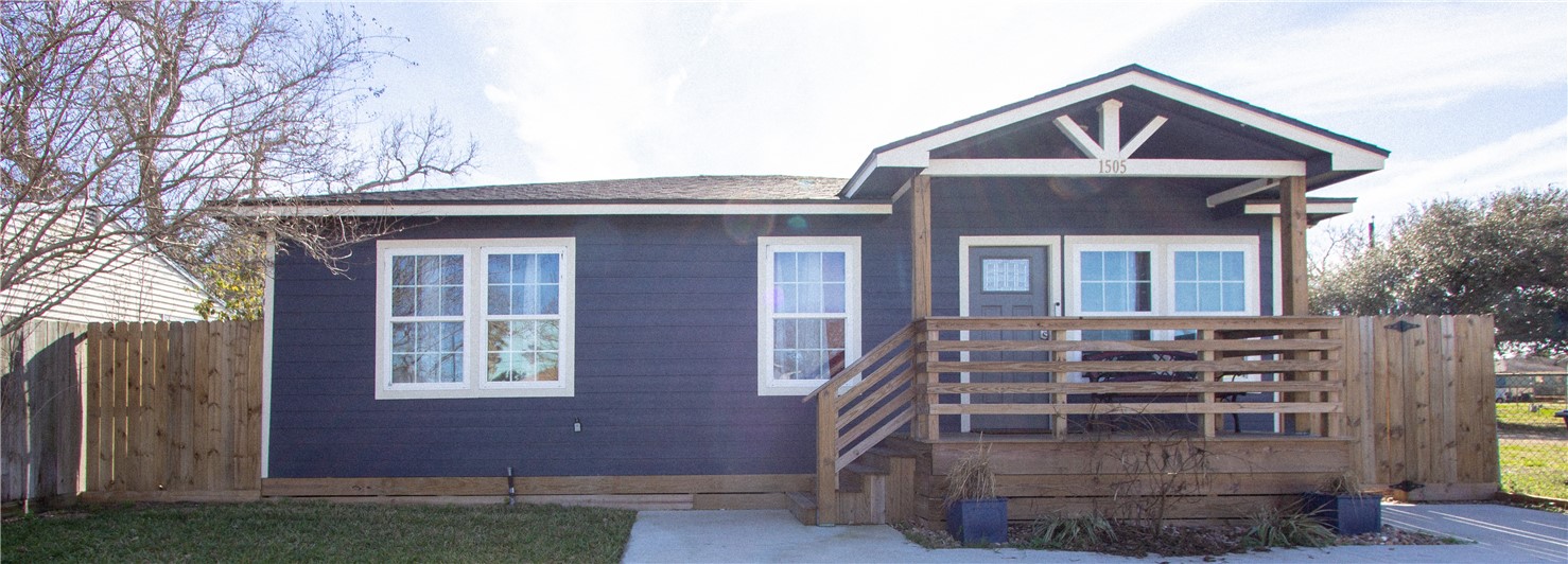 1505 Dewitt Street Corpus Christi, TX 78418 - Photo 1 of 18 a front view of a house with a yard