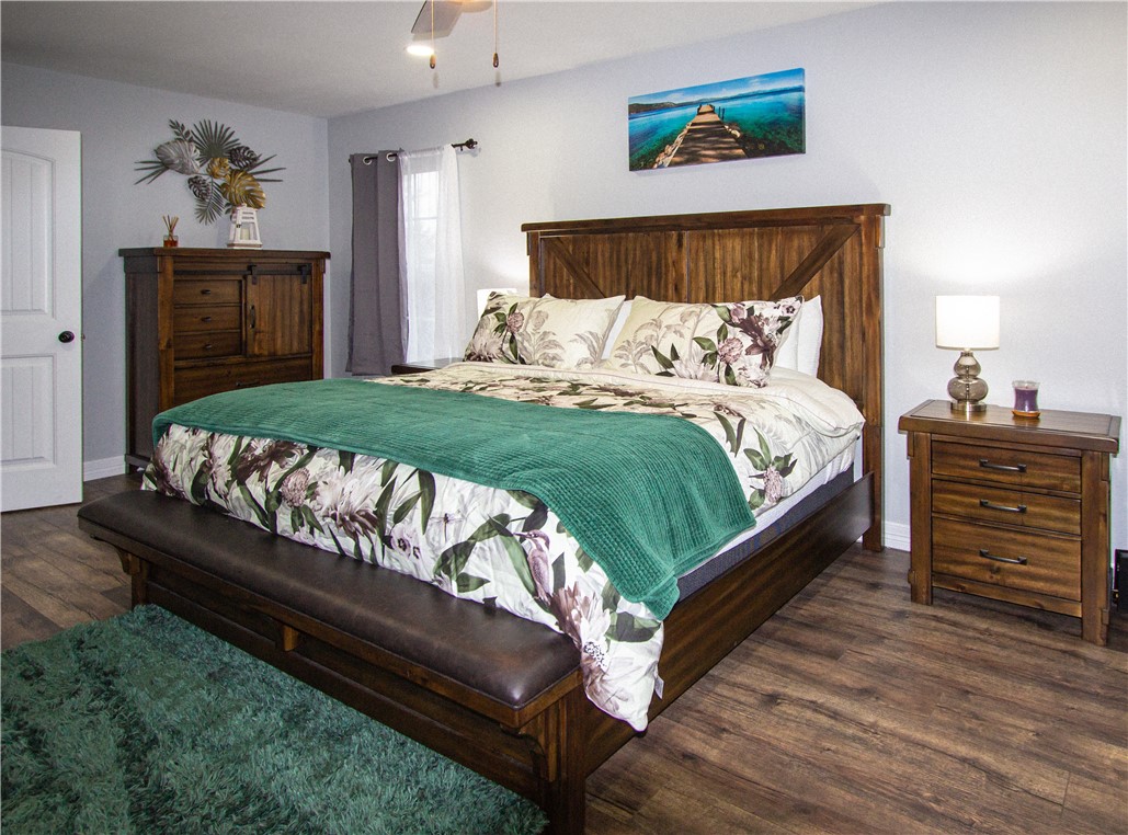 1505 Dewitt Street Corpus Christi, TX 78418 - Photo 14 of 18 a bed sitting in a bedroom and dresser