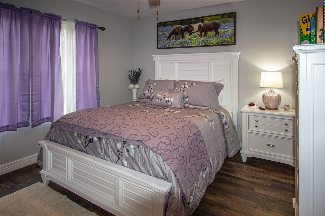1505 Dewitt Street Corpus Christi, TX 78418 - Photo 16 of 18 a bedroom with a bed and a painting on the wall