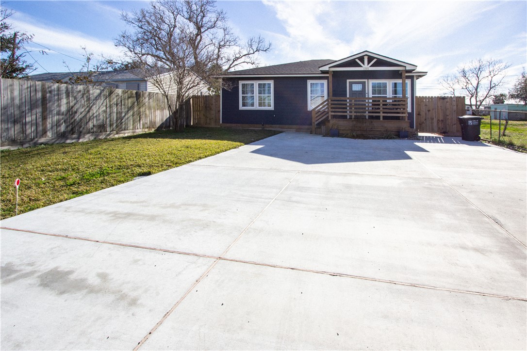 1505 Dewitt Street Corpus Christi, TX 78418 - Photo 3 of 18 a front view of a house with a yard
