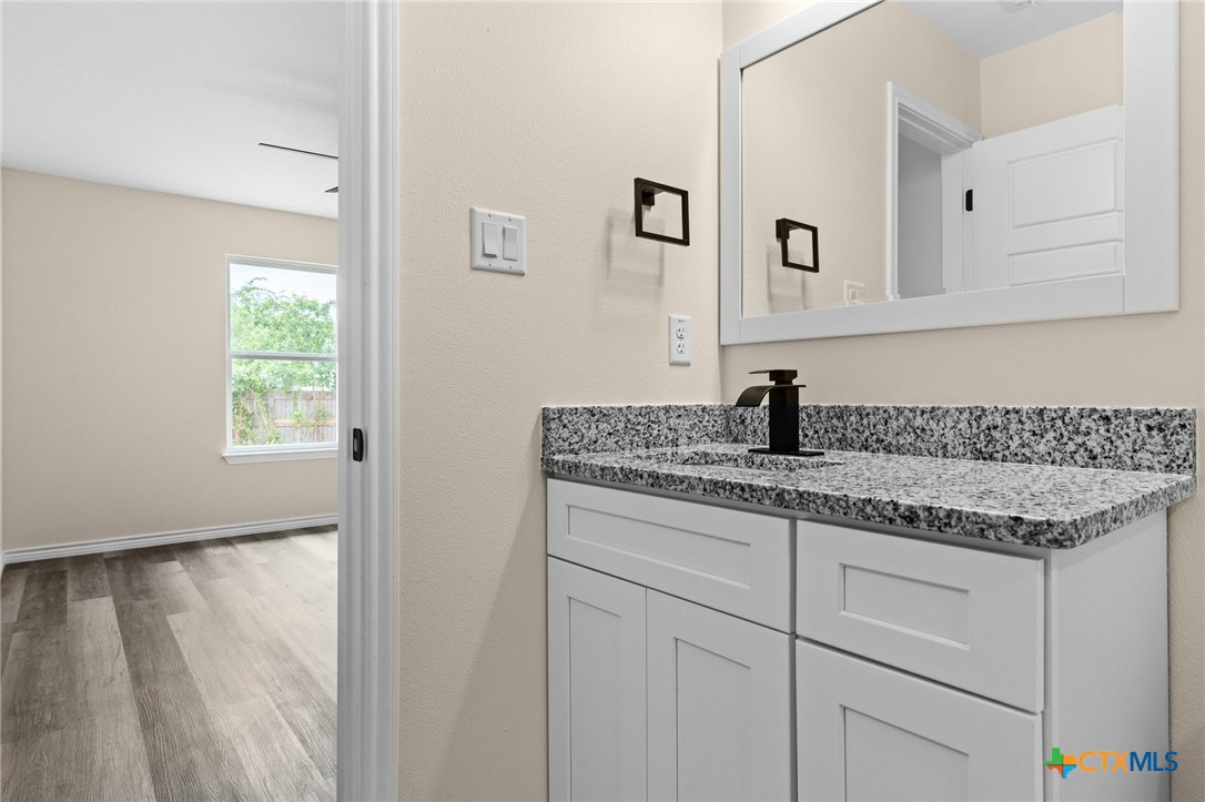 5222 Rose Gdn Loop Killeen, TX 76542 - Photo 13 of 25 a kitchen with a sink and cabinets