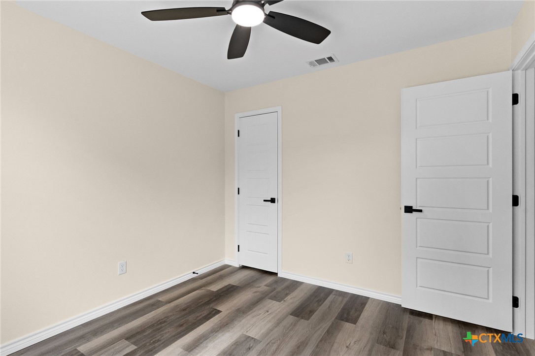 5222 Rose Gdn Loop Killeen, TX 76542 - Photo 18 of 25 a view of empty room with wooden floor