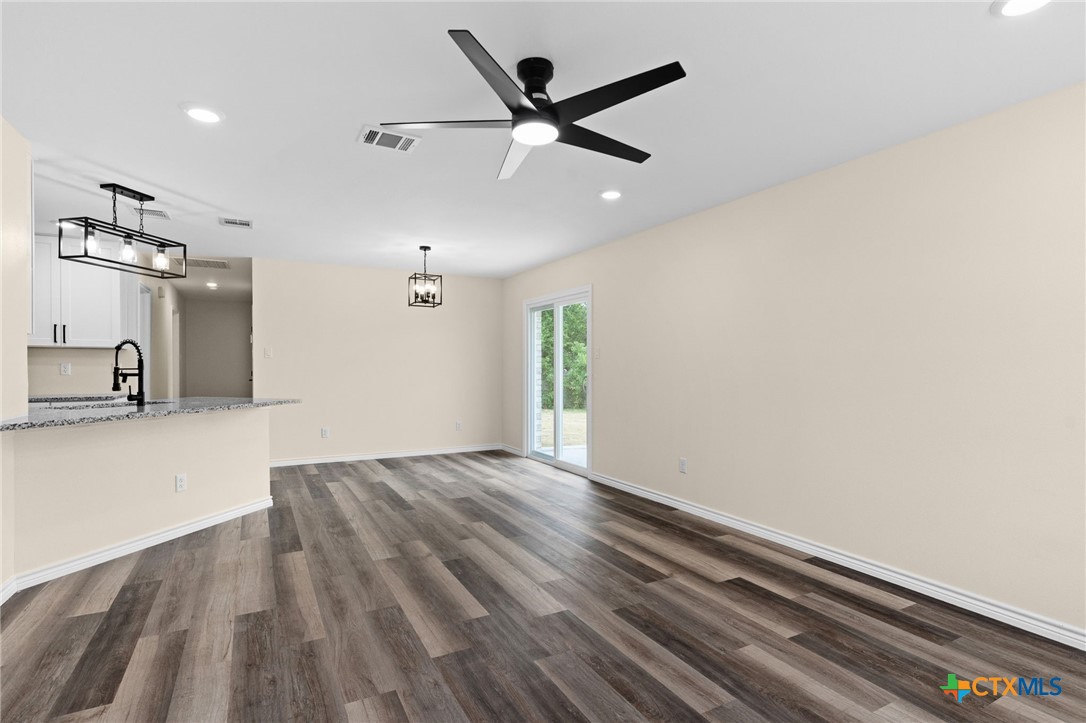 5222 Rose Gdn Loop Killeen, TX 76542 - Photo 5 of 25 wooden floor in an empty room with a window