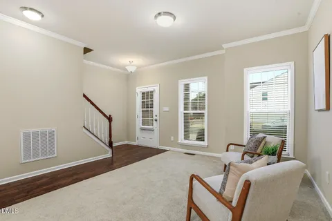 a living room with furniture and windows