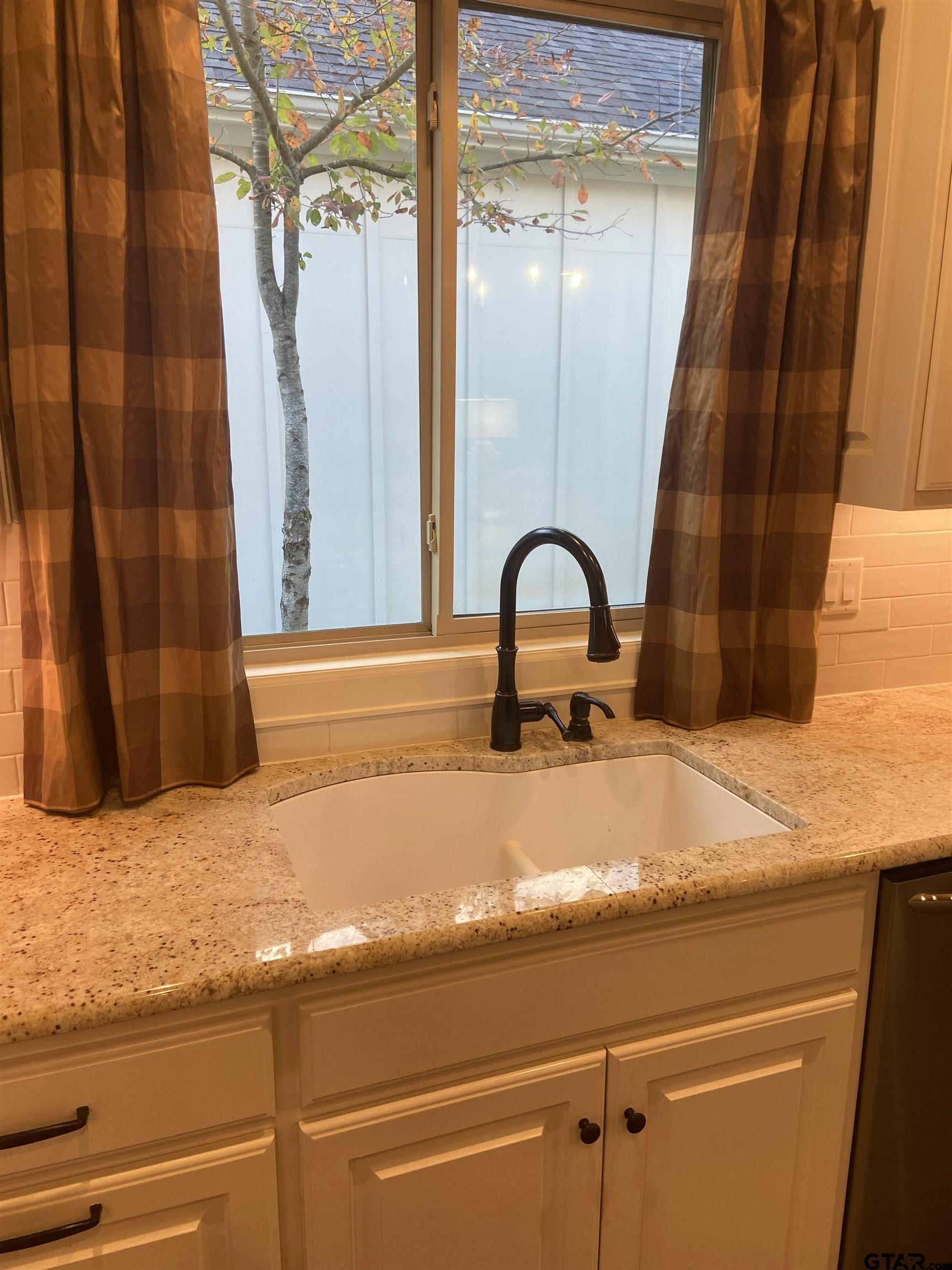 16864 Easy Street Flint, TX 75762 - Photo 16 of 37 a bathroom with a sink and mirror