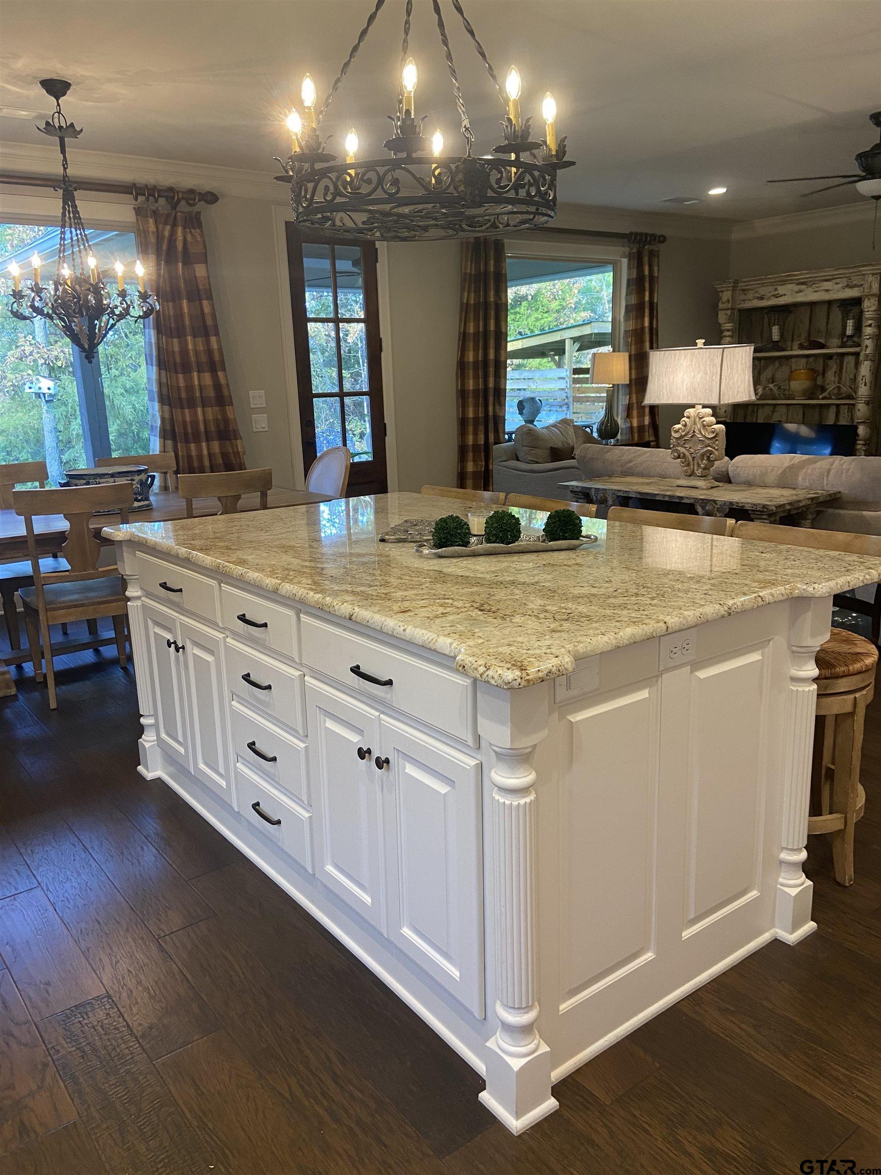 16864 Easy Street Flint, TX 75762 - Photo 17 of 37 a view of a kitchen counter space with wooden floor and staircase