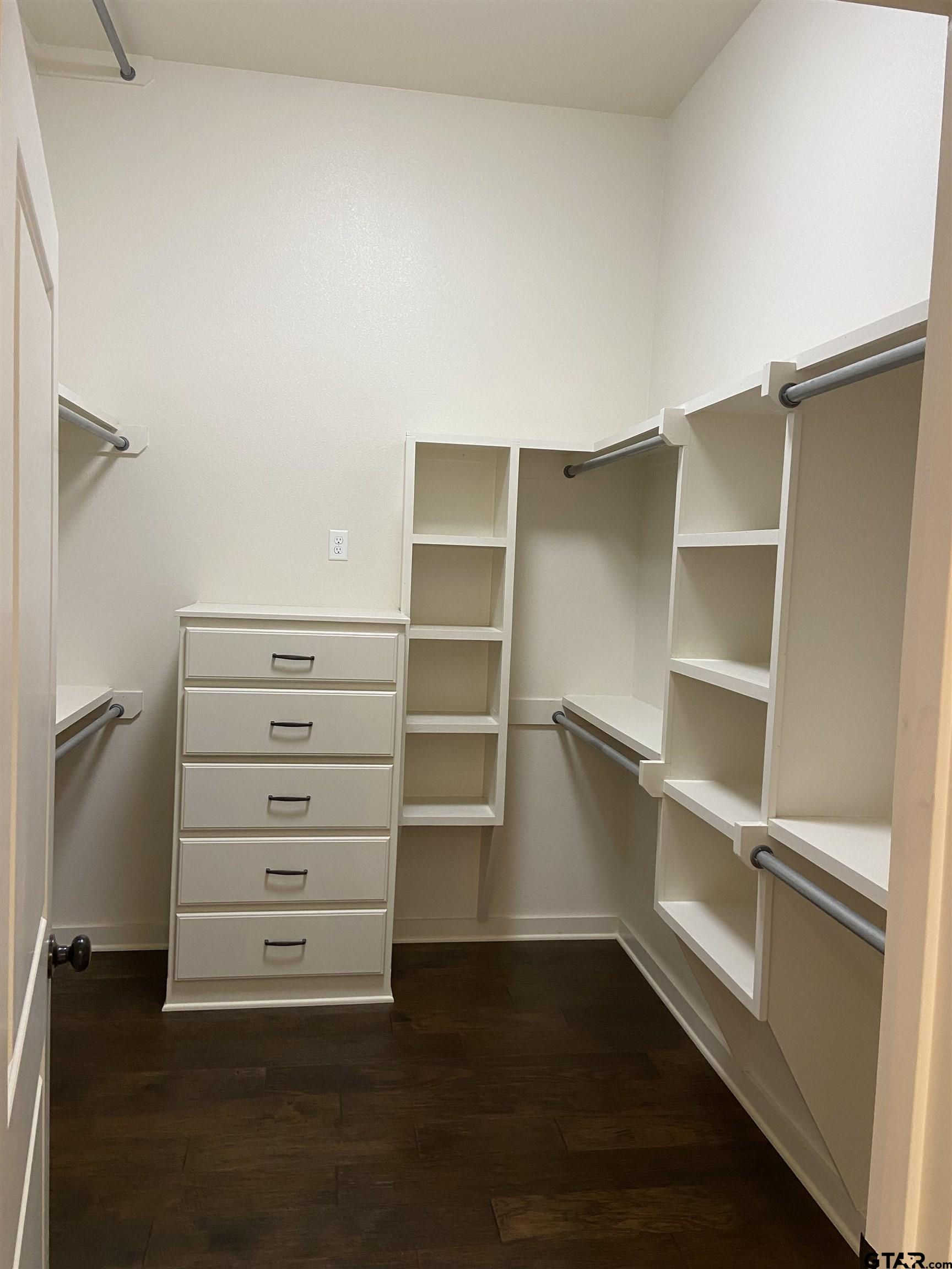 16864 Easy Street Flint, TX 75762 - Photo 28 of 37 a view of walk in closet with empty racks