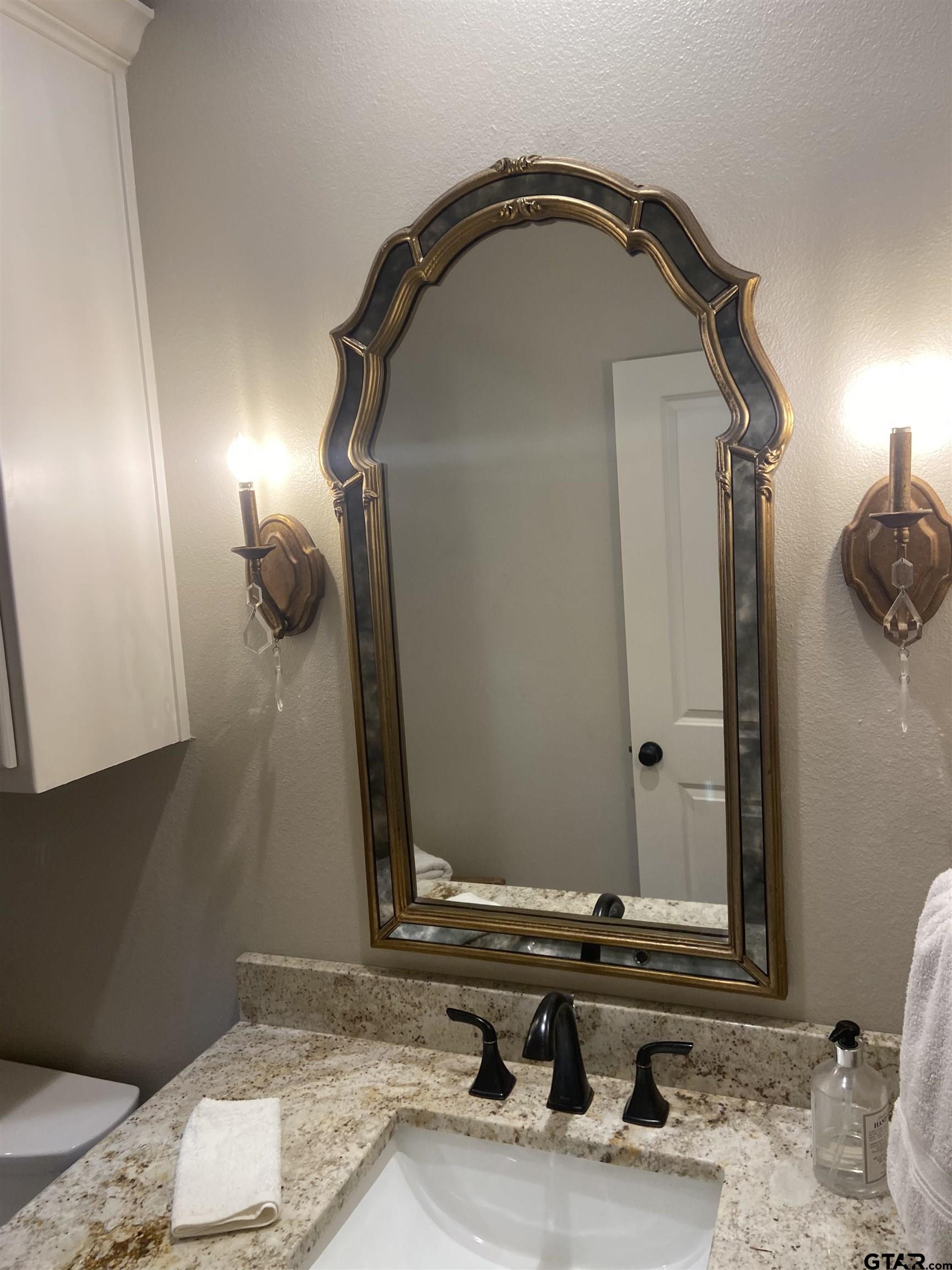 16864 Easy Street Flint, TX 75762 - Photo 9 of 37 a bathroom with a sink and a mirror