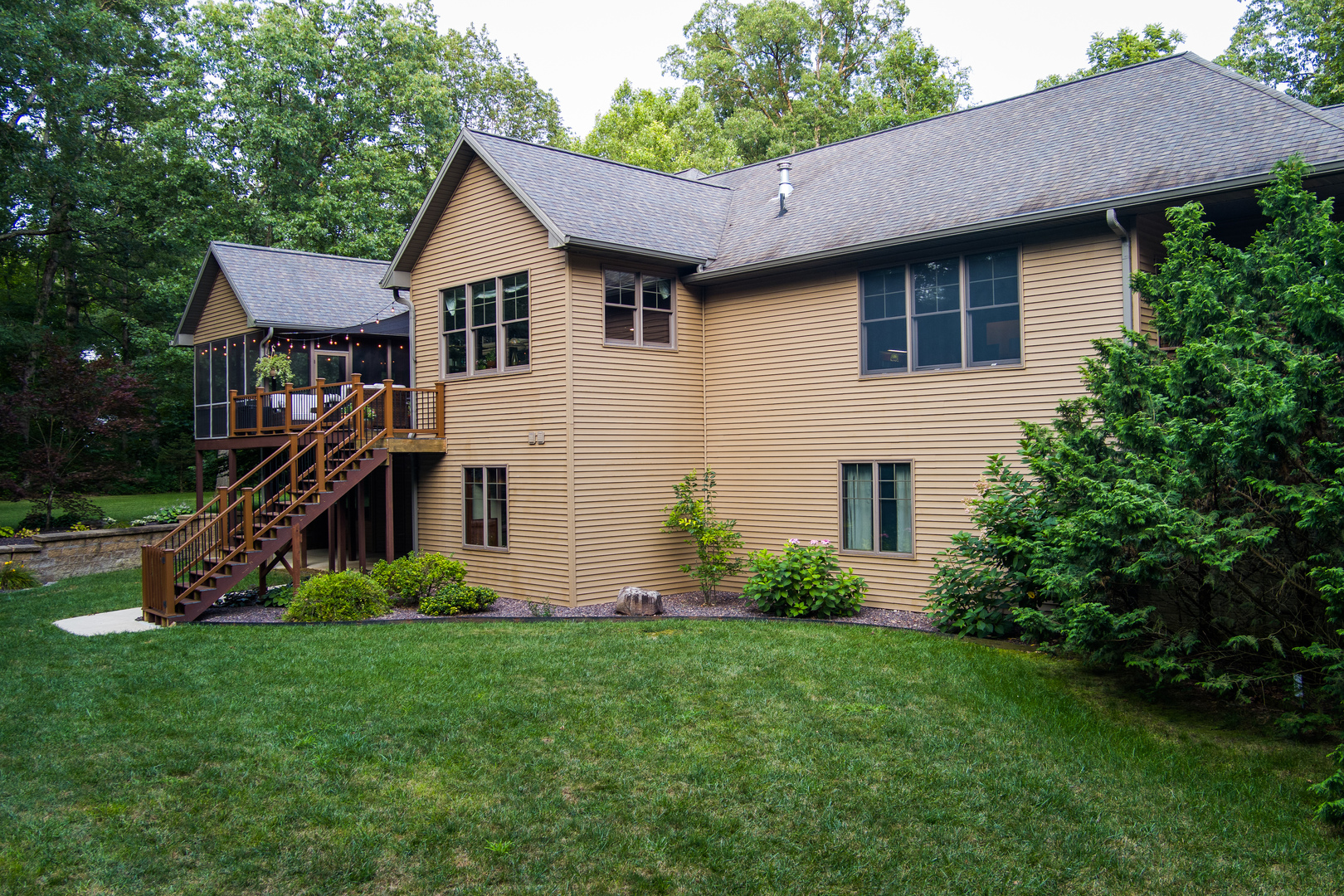 6690 Little Galilee Road Clinton, IL 61727 - Photo 4 of 53 a front view of a house with a garden and plants