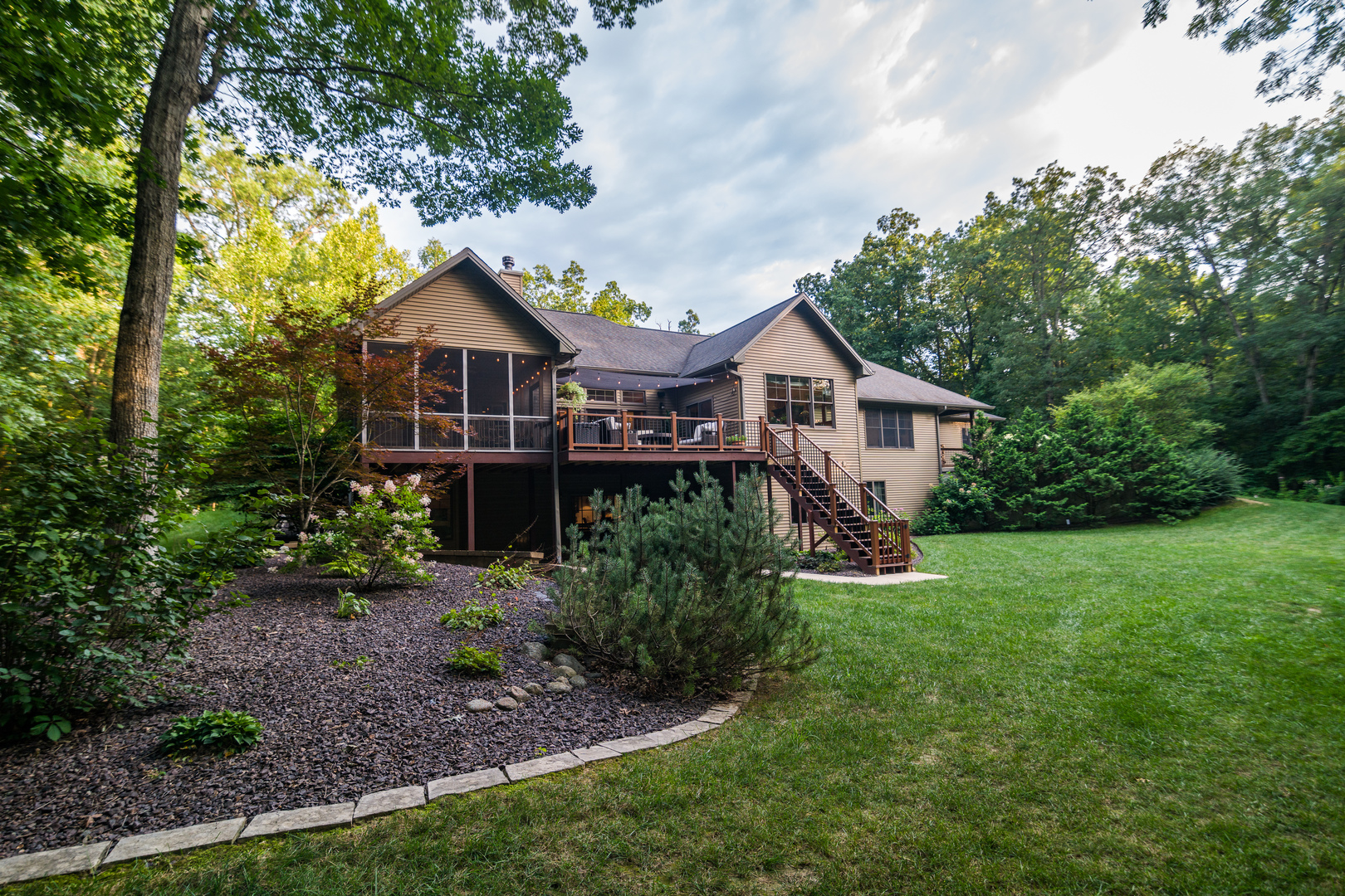 6690 Little Galilee Road Clinton, IL 61727 - Photo 7 of 53 a front view of a house with a garden and trees