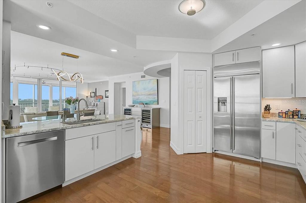 409 North Point Road, Unit 601 Osprey, FL 34229 - Photo 12 of 63 a kitchen with stainless steel appliances granite countertop a refrigerator and a sink