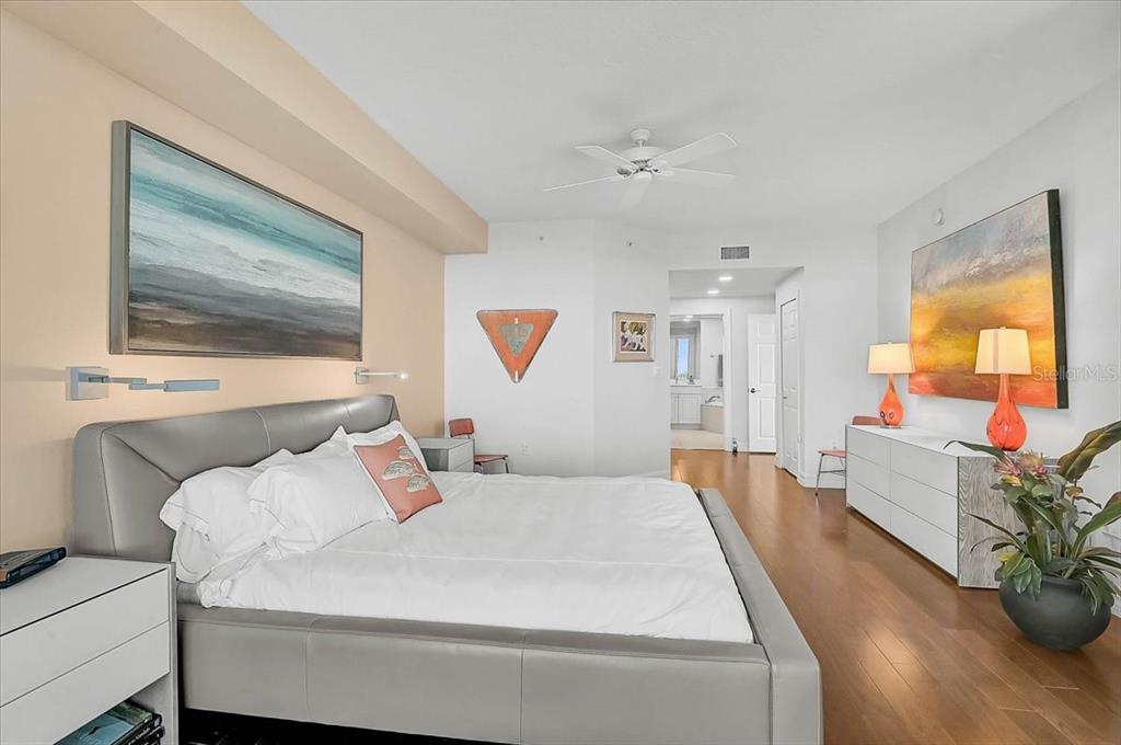 409 North Point Road, Unit 601 Osprey, FL 34229 - Photo 20 of 63 a bedroom with a bed and wooden floor