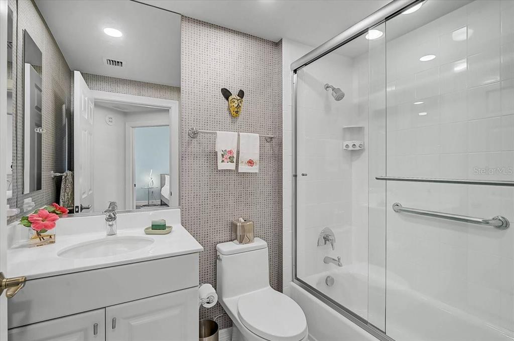 409 North Point Road, Unit 601 Osprey, FL 34229 - Photo 25 of 63 a bathroom with a sink toilet and shower