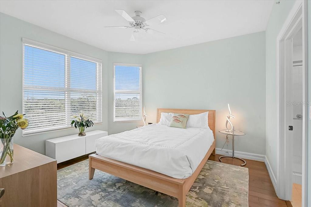 409 North Point Road, Unit 601 Osprey, FL 34229 - Photo 26 of 63 a bedroom with a bed and a table