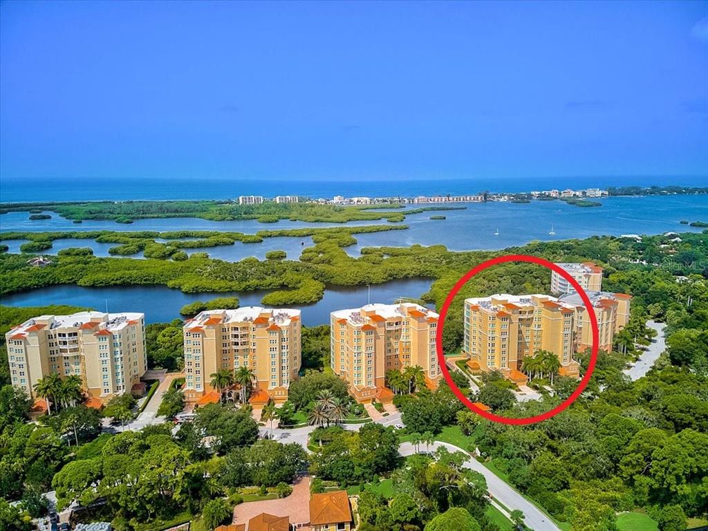 409 North Point Road, Unit 601 Osprey, FL 34229 - Photo 3 of 63 an aerial view of a city with swimming pool and outdoor seating